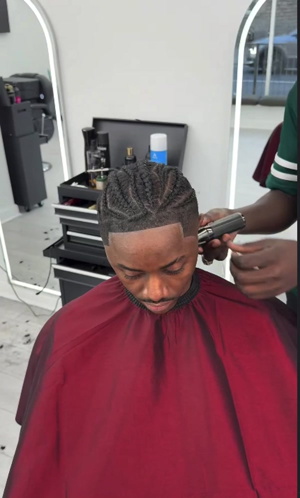 Barber refining a haircut at the shop